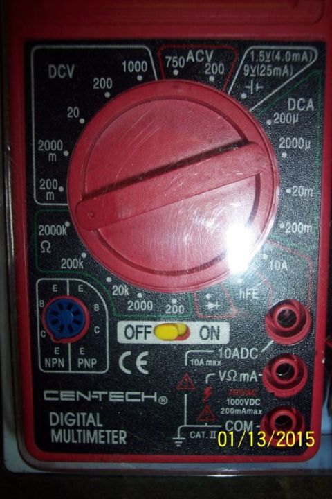 1973 Ford F-250 - This digital multimeter has settings for DCV, ACV, DCA, resistance, and transistor hFE testing.