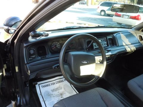 2001 Ford Crown Victoria - Interior view of a 2001 Ford Crown Victoria, the dashboard and steering wheel.