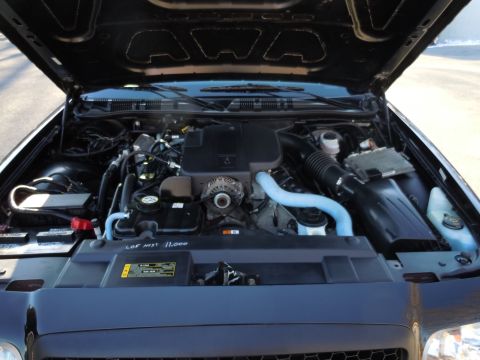 2001 Ford Crown Victoria - Engine bay of a 2001 Ford Crown Victoria, showing the V8 engine and associated components.