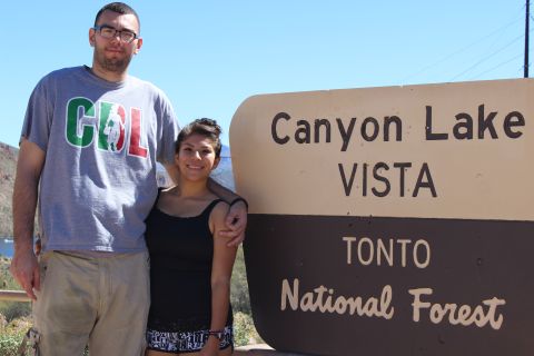 1996 Ford Bronco - A man and a woman pose for a photo in front of a sign for Canyon Lake Vista in Tonto National Forest.