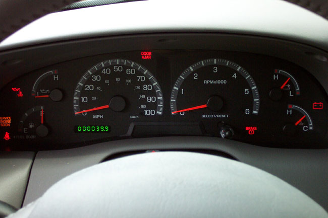 Ford truck gauge cluster with 100 mph speedometer and 399-mile odometer reading