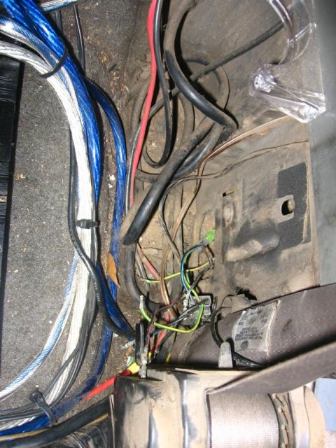 1988 Ford Bronco - A close-up view of a complex vehicle wiring harness with various cables and connections visible connectors.