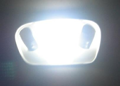 1988 Ford Bronco - Close-up of a vehicle's interior dome light assembly.