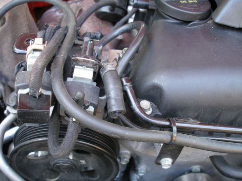 2010 Hyundai Genesis - Engine bay detail showing various hoses and mechanical parts.