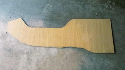 1982 Ford Bronco - A custom-shaped wooden template for a vehicle console lies on a concrete surface.