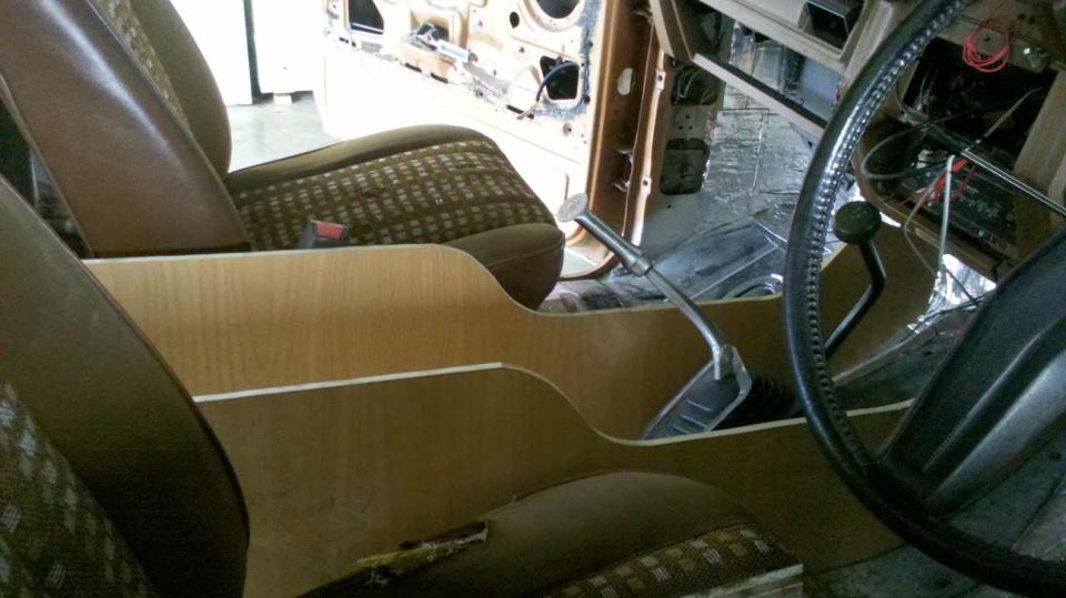 1982 Ford Bronco interior showing the center console, dashboard, and steering wheel