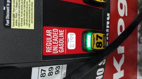 1995 Ford Bronco - Close-up of a gas pump display showing the price per gallon and octane selection buttons.
