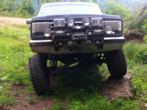 1988 Ford Bronco - This 1988 Ford Bronco is equipped with auxiliary lights and large tires, ready for off-road adventures.
