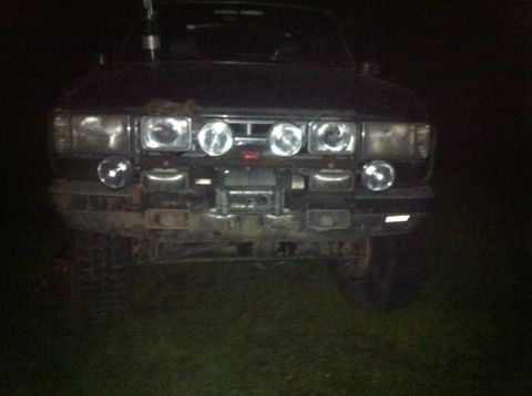 1988 Ford Bronco - This SUV has a front end with several lights and a winch, suggesting it's prepared for off-road use.