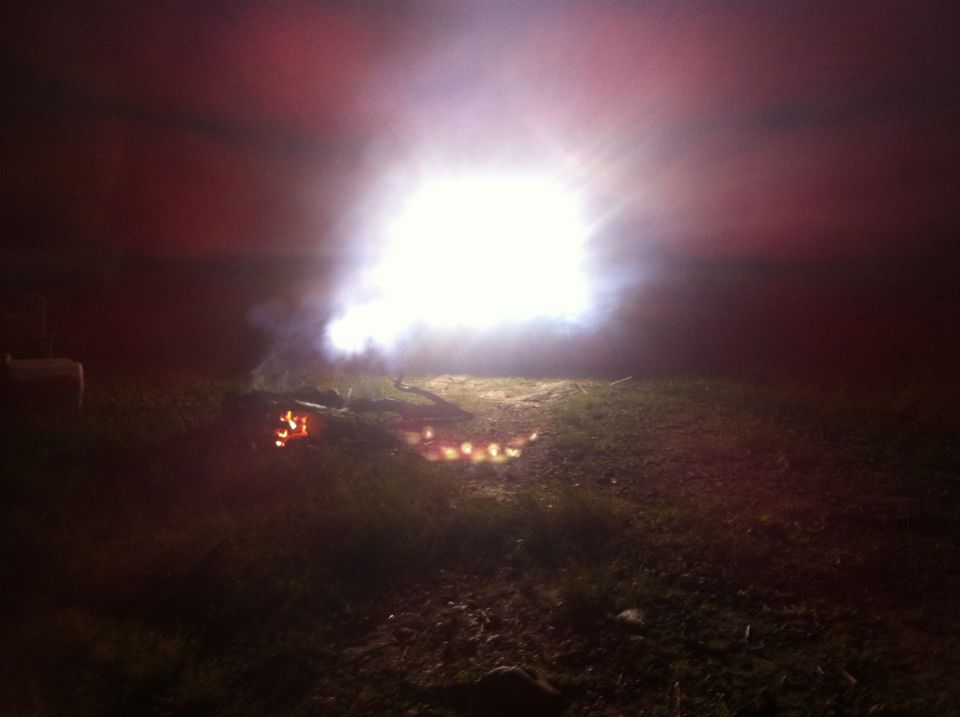 Bonfire at night with bright light and smoke