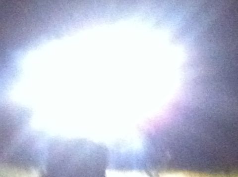 1988 Ford Bronco - A bright light flare obscures most of the vehicle in this photo, making identification difficult.