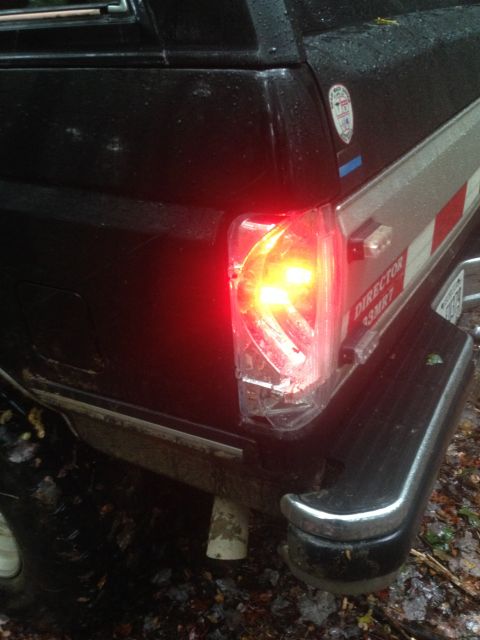 1988 Ford Bronco - Rear brake light of a 1988 Ford Bronco is on, showing the vehicle's corner detail.