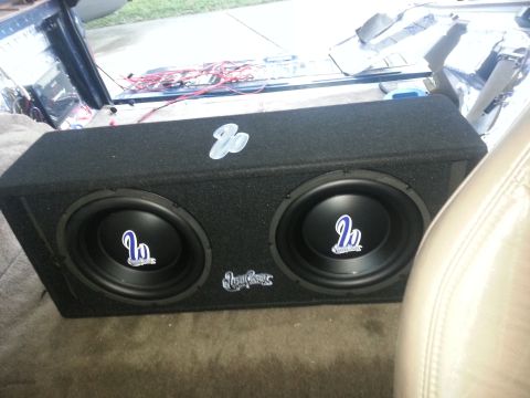 1994 Ford Bronco - Photo of a dual subwoofer enclosure placed in a vehicle interior during an audio install.