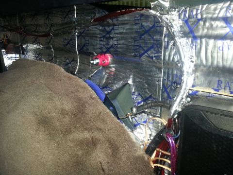 1994 Ford Bronco - Photo of a vehicle interior lined with RattleTrap sound-deadening foil with audio wiring routed through.