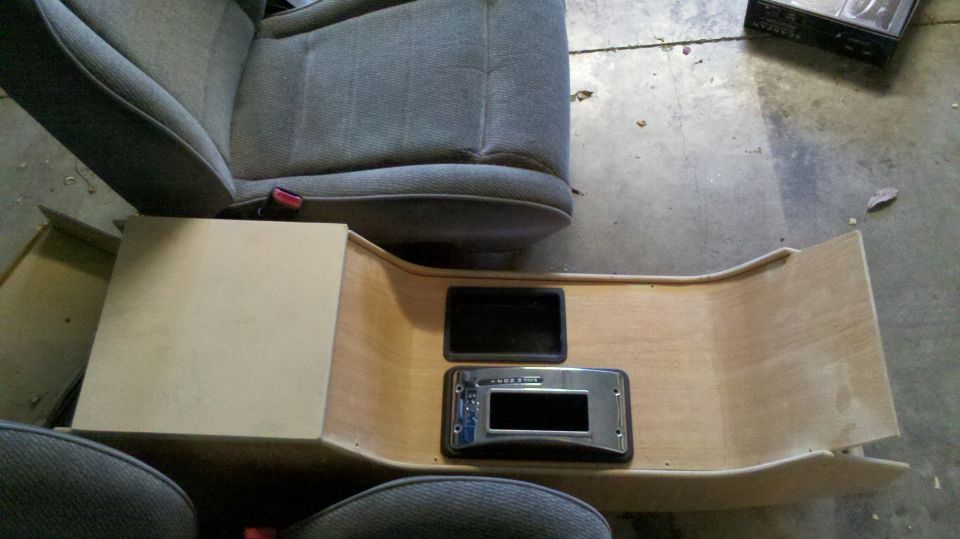 Removed center console and bucket seat on garage floor