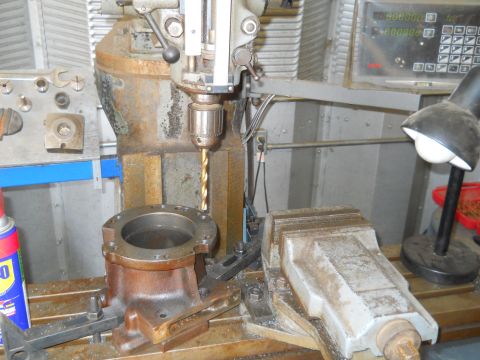 1992 Ford Bronco - A drill press is used to machine a metal component secured in a vise, with a digital readout visible in the background.