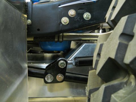 1992 Ford Bronco - Close-up view of vehicle undercarriage components and a tire, with Supermotors branding visible.