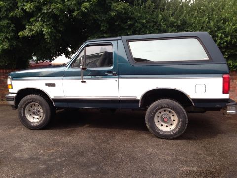 1994 Ford Bronco - This 1994 Ford Bronco is shown from the side, a two-tone green and white paint scheme.