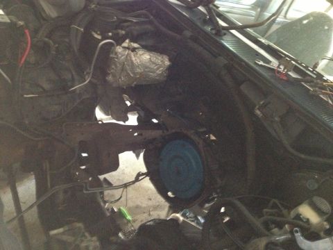 1994 Ford Bronco - View of the engine bay, showing a blue fan and various wires and components.