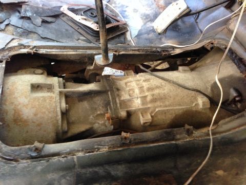 1979 Ford Bronco - The image shows a close-up view of a vehicle's transmission and transfer case, likely from a 1979 Ford Bronco, as indicated by the owner's…