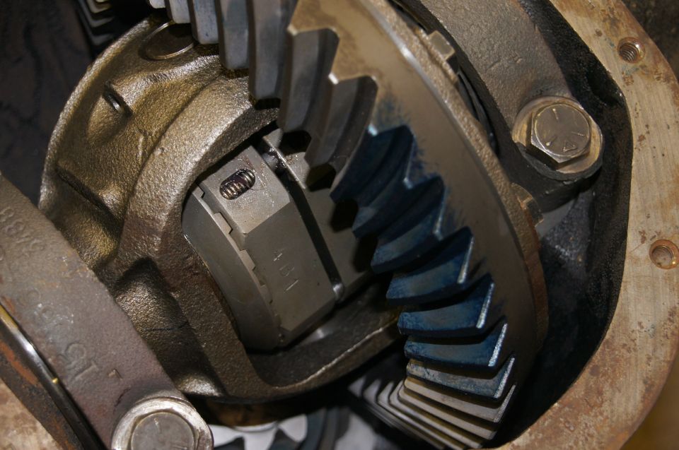 Differential assembly with ring gear and pinion gears, showing blue marking compound.
