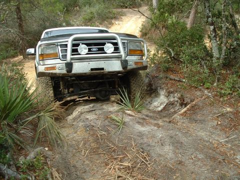 1995 Ford Bronco - This 1995 Ford Bronco navigates a challenging off-road trail, its capabilities.
