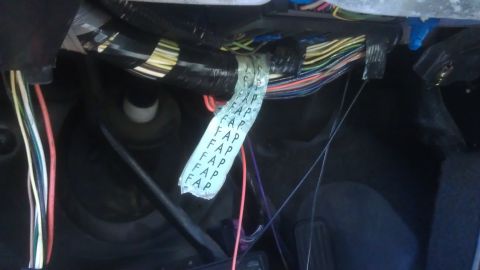 1994 Ford Bronco - Vehicle wiring harness with a label that has repeated text.