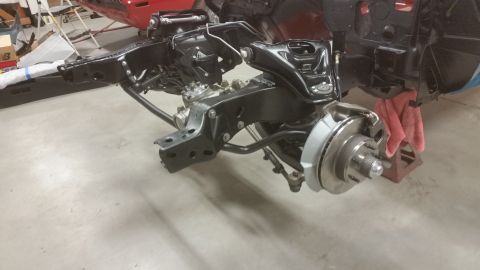 1970 Pontiac Trans Am - Close-up view of a car's front suspension and brake system, likely during a restoration project.