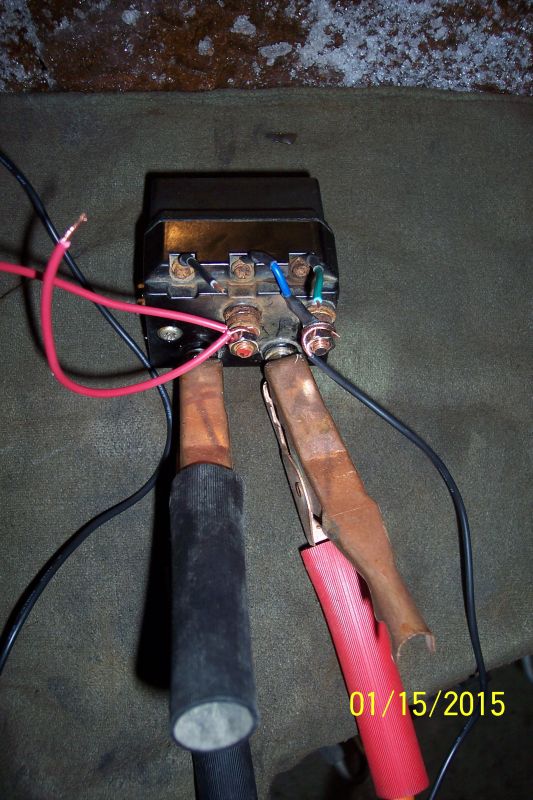 Electrical relay with jumper cables attached.