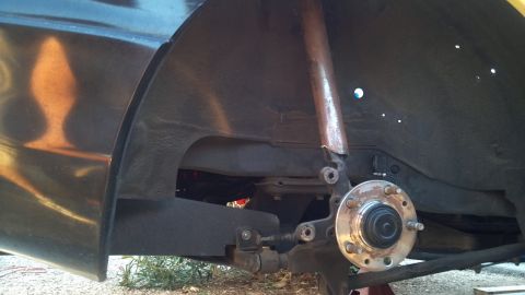 1995 Ford Probe - A close-up view of the wheel hub and suspension components of a vehicle, likely undergoing maintenance or modification. The wheel hub shows…