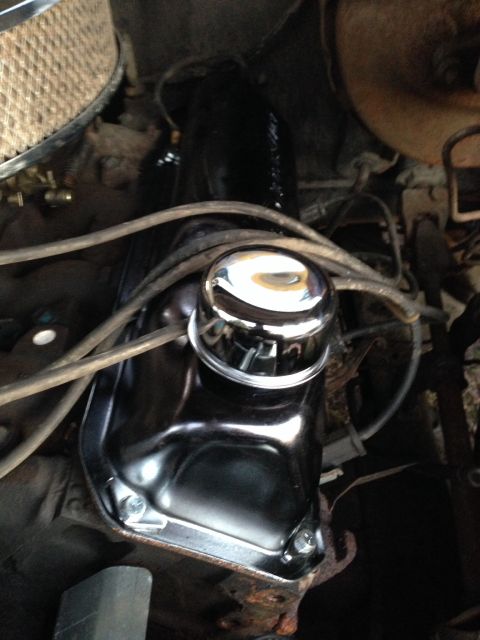 1979 Ford Bronco - A close-up view of the engine bay of a 1979 Ford Bronco, focusing on the chrome oil cap and valve cover.