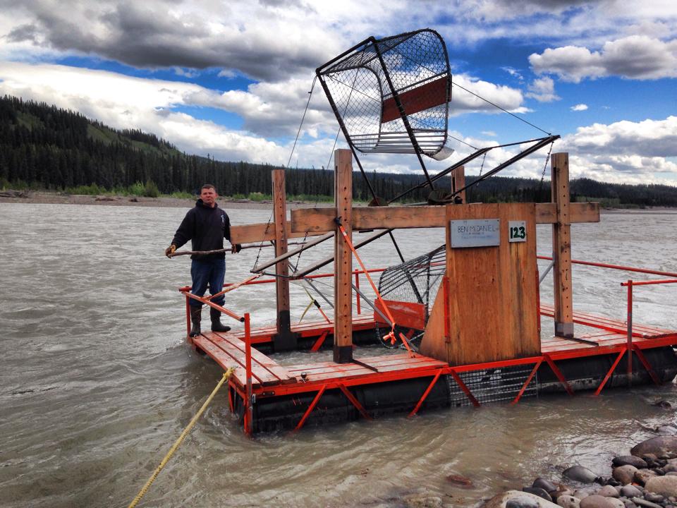 Fishing platform on a body of water with a person standing on it