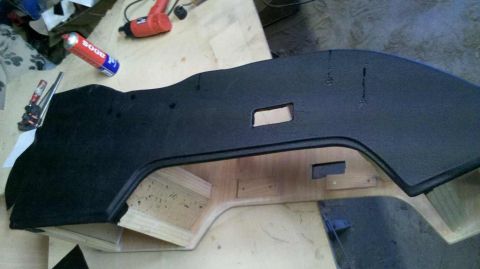 1982 Ford Bronco - A black console panel is shown with a wooden frame and various tools in the background.