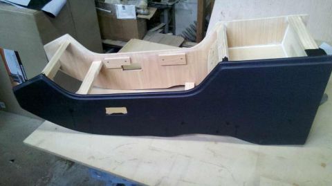 1982 Ford Bronco - Unfinished wooden center console structure with black plastic trim is visible.