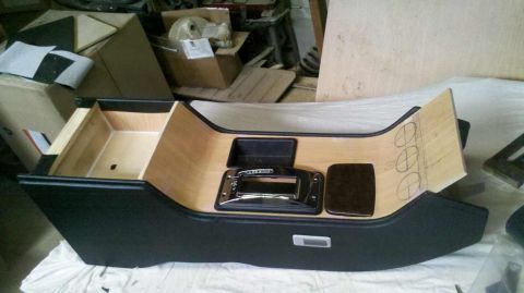 1982 Ford Bronco - Custom center console with a gear shifter, wood accents, and markings for gauge installation.