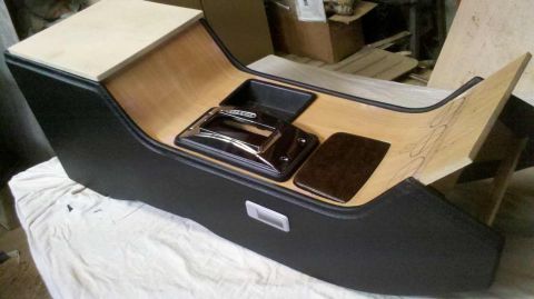 1982 Ford Bronco - Custom center console assembly, possibly for a classic truck or SUV, with unfinished wood accents.