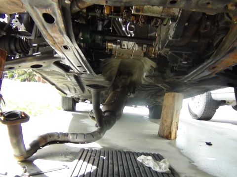 1991 Ford Probe - The underside of a vehicle is shown with parts removed, indicating maintenance or repair work is in progress.
