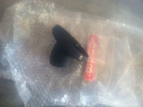 2005 Honda TRX 450 R - A black plastic part is shown next to a red label. The registry claims it is for a 2005 Honda TRX 450 R, but this cannot be confirmed from…