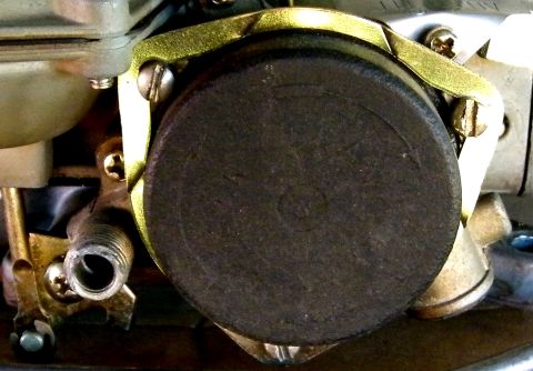 1968 Mercury Cougar - A detailed view of a carburetor diaphragm, a crucial component for fuel delivery in older vehicles.
