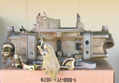 1968 Mercury Cougar - A Holley carburetor, a key engine component, is shown close-up on a box.
