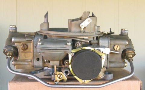 1968 Mercury Cougar - A carburetor part is shown against a light-colored background.