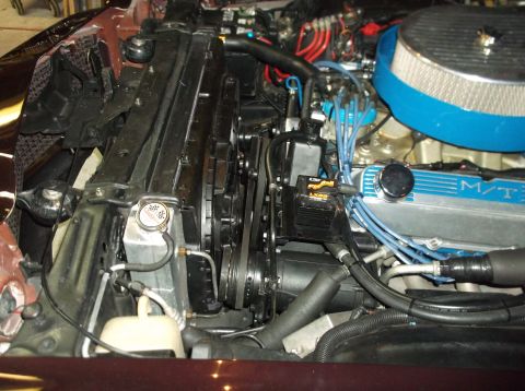 1979 Ford Ranchero - Close-up view of a vehicle's engine bay, showing the radiator, fan, and various engine components.