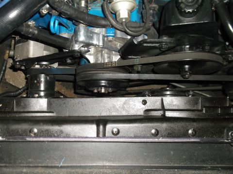 1979 Ford Ranchero - Close-up view of engine components, including belts, pulleys, and a power steering pump.