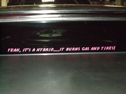 1979 Ford Ranchero - A humorous sticker on the rear window of a vehicle reads, "YEAH, IT'S A HYBRID....IT BURNS GAS AND TIRES!"