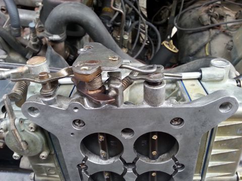 1981 Ford Bronco - This image shows the intricate mechanical linkage of a vehicle's carburetor, not a specific model year.