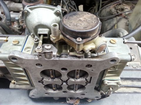 1981 Ford Bronco - Close-up of a Holley carburetor, a key engine component, with visible text on its cap.