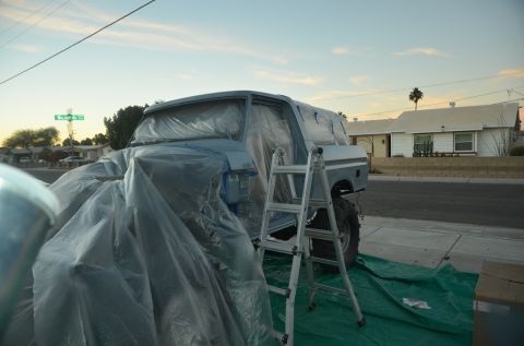 1979 Ford Bronco - 1979 Ford Bronco undergoing preparation for a paint job, covered in protective plastic.