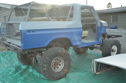 1979 Ford Bronco - This modified Ford Bronco is being worked on, a custom roll cage and off-road tires.