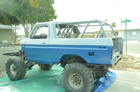 1979 Ford Bronco - This modified 1979 Ford Bronco features a roll cage and is lifted on large off-road tires.