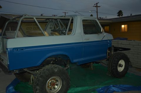 1979 Ford Bronco - This modified 1979 Ford Bronco features a custom roll cage and appears to be undergoing some work.